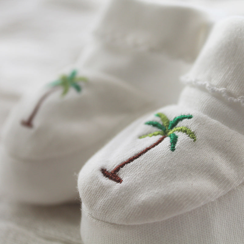 white pima cotton booties with palm tree