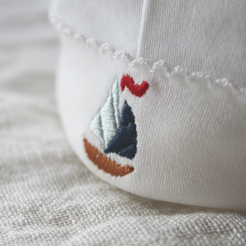 white pima cotton beanie with sailboat