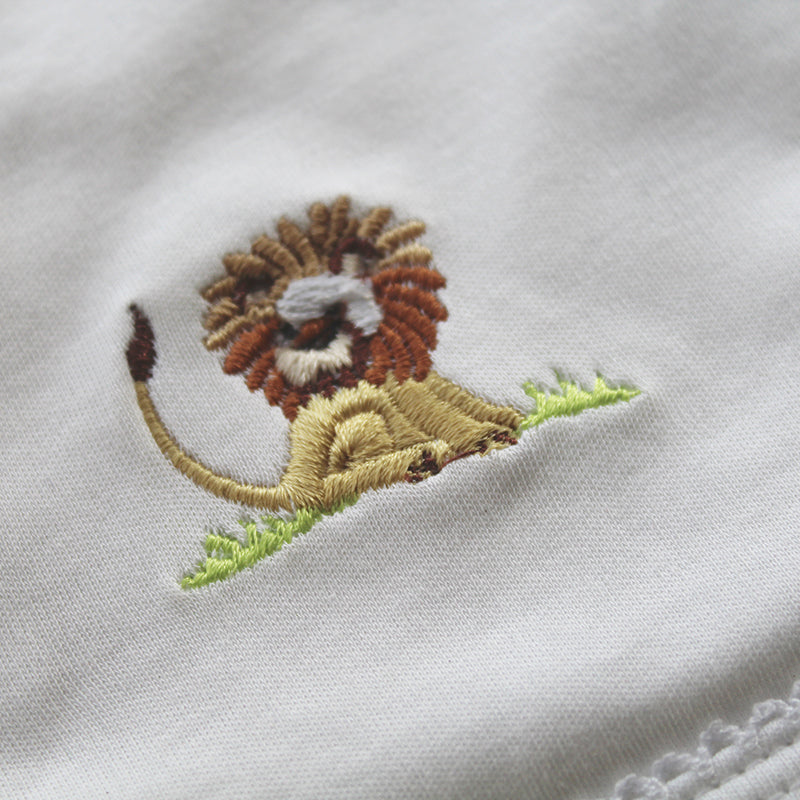 white cotton bib with lion