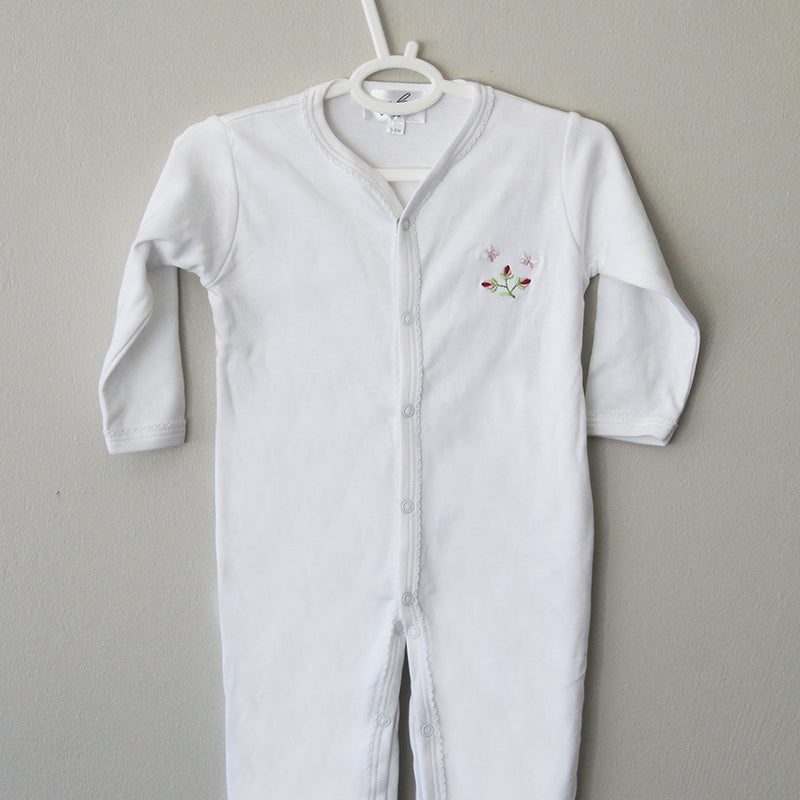 white cotton onesie with rosebud