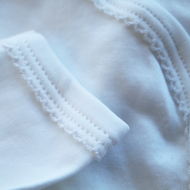 white cotton onesie with rosebud