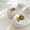 white pima cotton booties with lion and picot trim